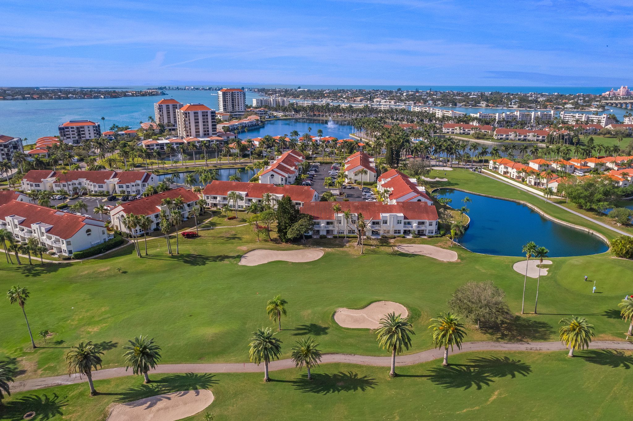 An aerial view of a resort with a golf course.