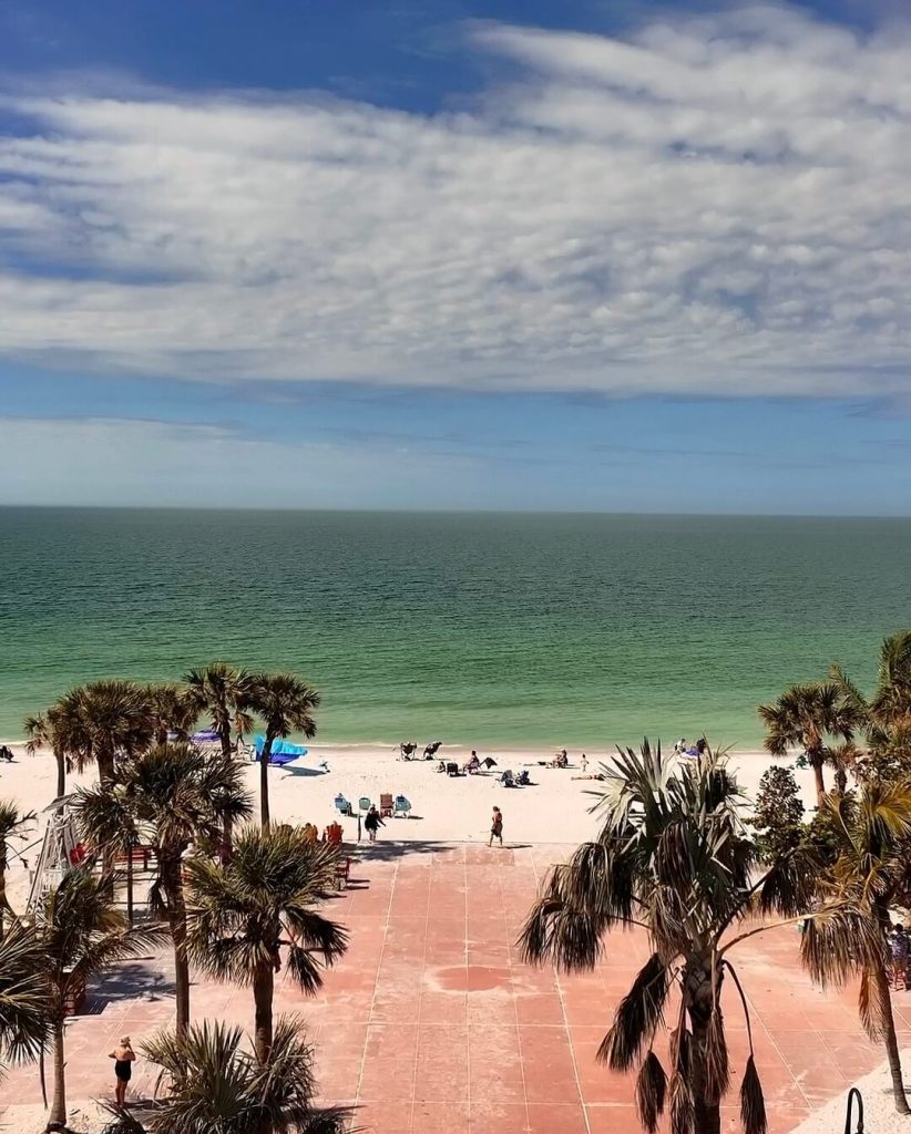 Scenic beach view featuring turquoise-green ocean water