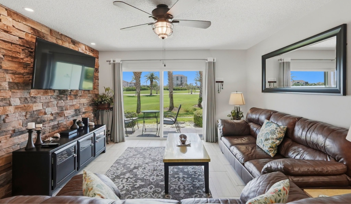 modern living room featuring a brown leather sectional sofa